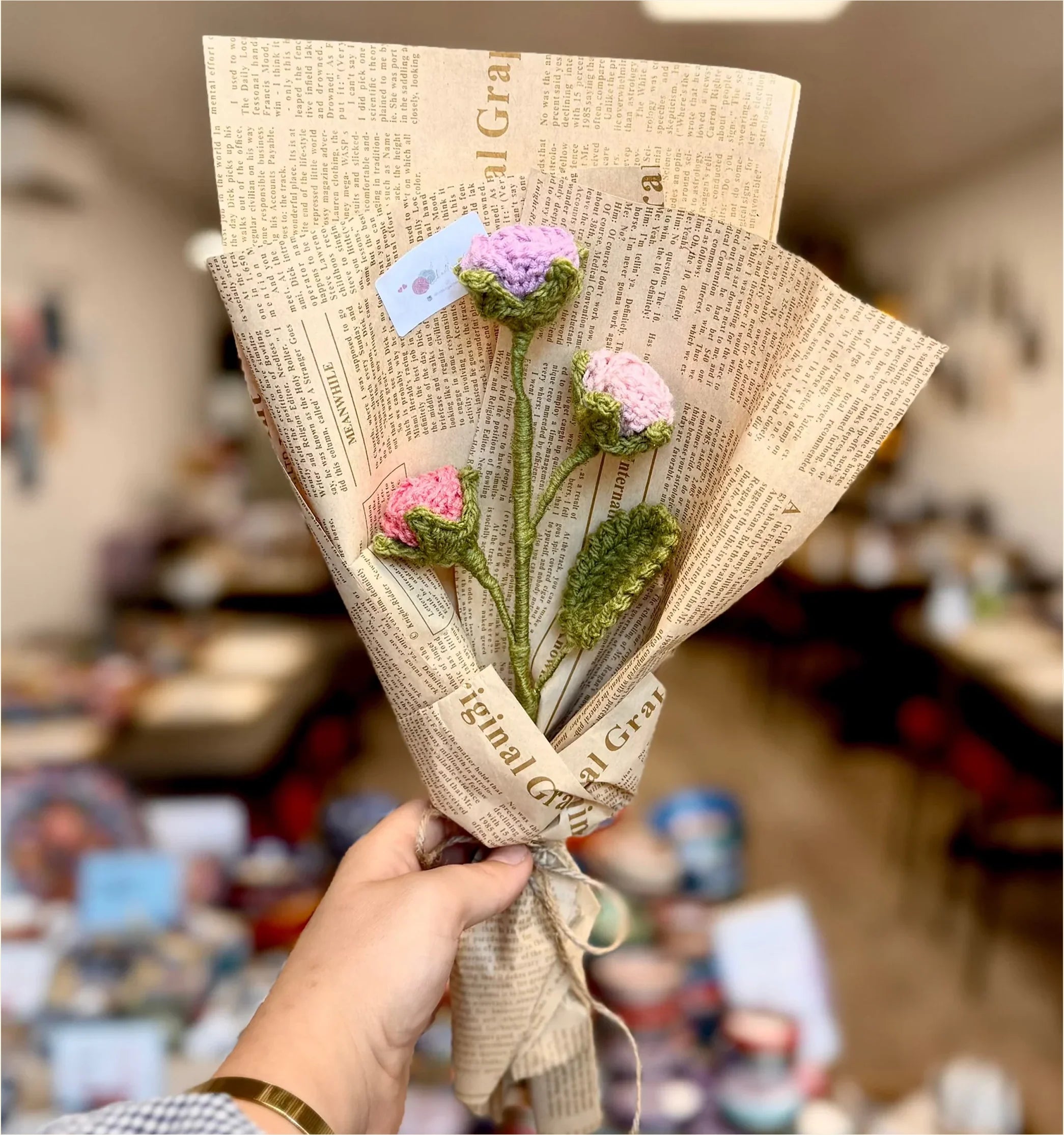 Crocheted rose bouquets displayed on a table
