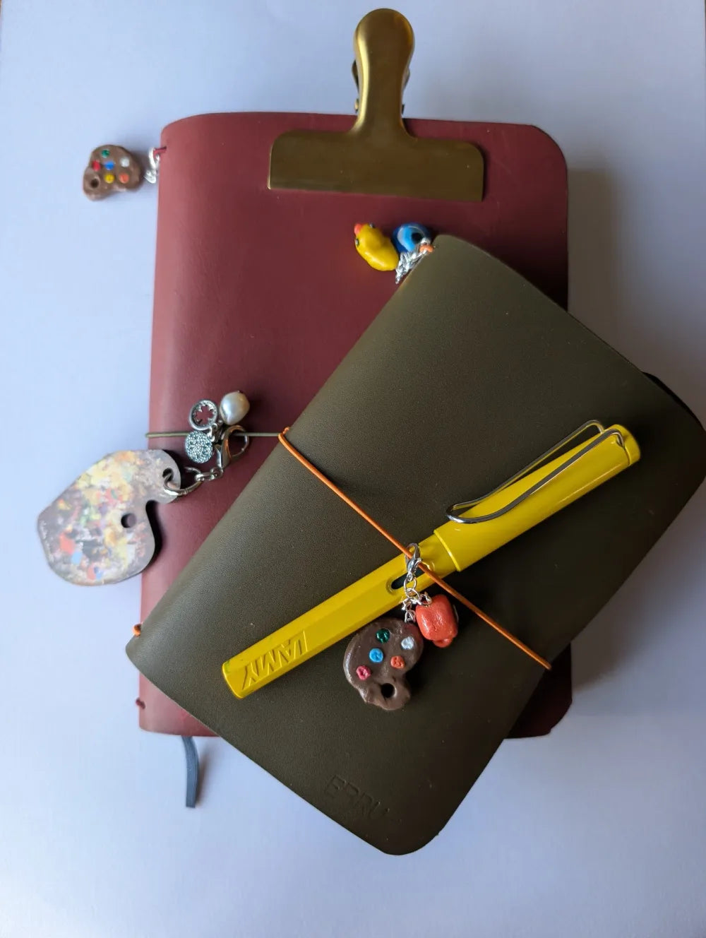 Leather journals with colourful cords and decorative charms