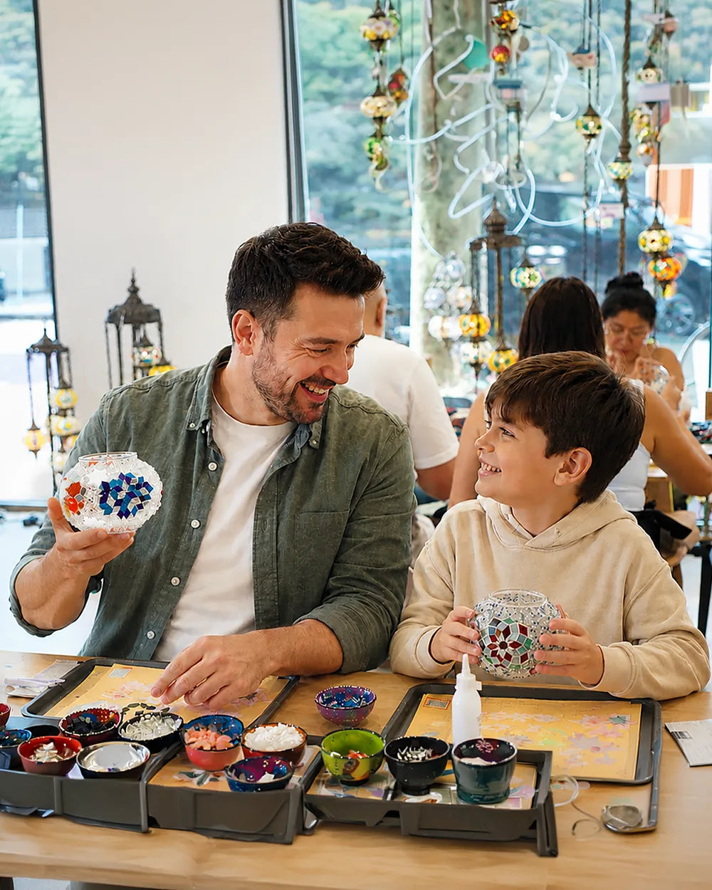 Guests making colourful pieces at the Art Masterclass studio